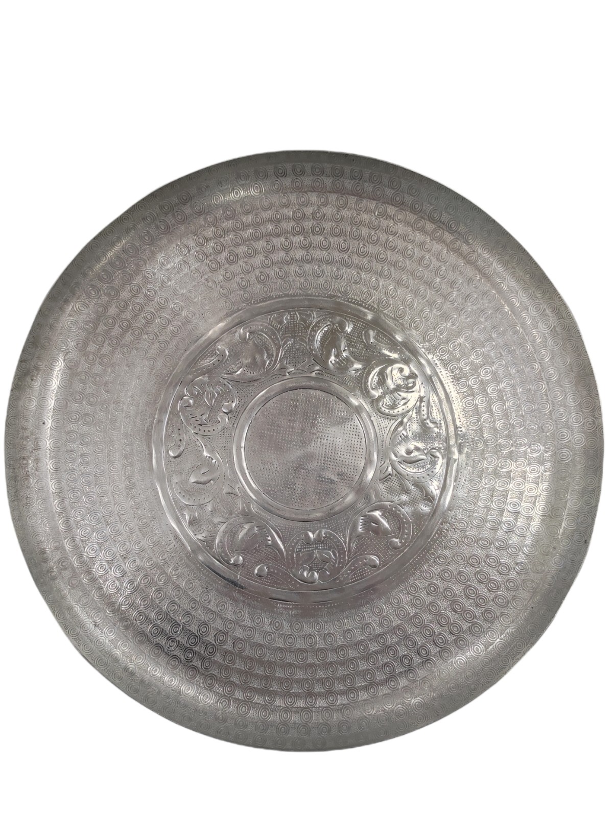 Round metal tray with embossed design